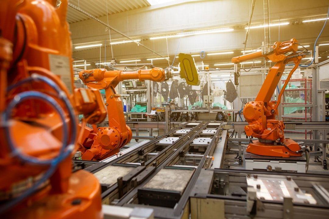Robotic arms in a modern factory setting